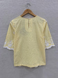 Yellow loop embroidered top